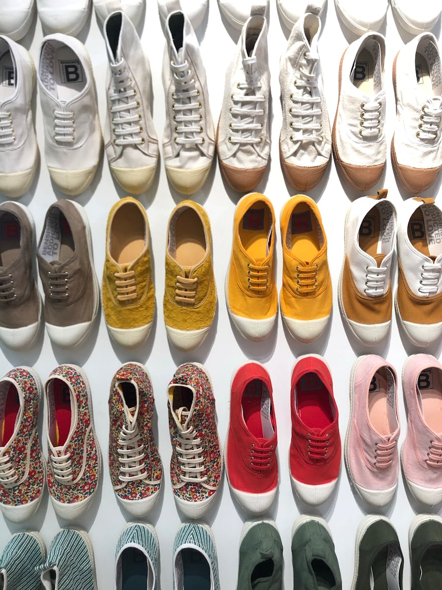 Vibrant rows of trendy canvas shoes showcasing diverse designs and colors for fashion enthusiasts.